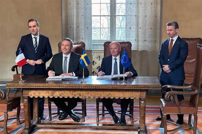 French-Swedish officials at signing ceremony.