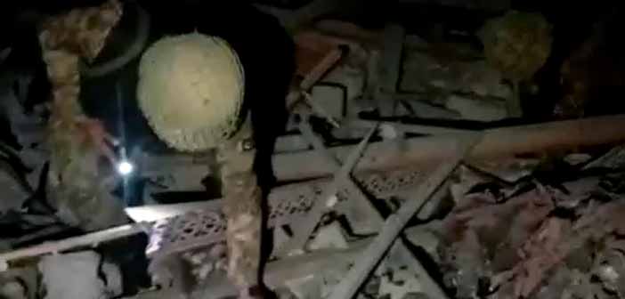 Pakistan Army Soldiers Inspecting Debris of a Terror Camp Following India's Military Strike.